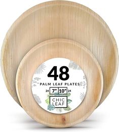 three wooden plates with the number 48 on them and one has an image of palm leaves