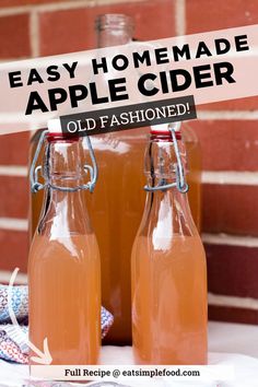 homemade apple cider recipe in two glass bottles with an old fashioned label on top