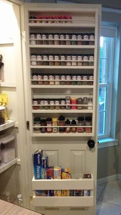 an open pantry door with canned food in it