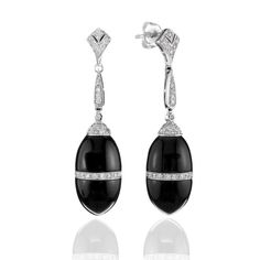 "These art deco inspired onyx and diamond earrings are perfect for any occasion.  In ancient times, onyx is referred to as a protector from evil.  It is also known as a protector for harmonious relationships.  These are from our vintage inspired collections and are new and made with the latest technology by our skilled craftsman.  Presented in a gift box Metal Type : 14Kt White Gold Metal Weight : 3.56 grams Earring Backing : Friction Back Brand : Aristo Diamond : Round Diamond Weight : 0.64 cttw Diamond Quantity : 94 Color : G-H Clarity : VS -SI  Stone Type : Black Onyx Onyx Weight : 28.46 Dimensions : 1.75\" long Style : Dangle/Drop    Your browser does not support our video." Bridesmaid Gifts Jewelry, Diamond Dangle Earrings, Onyx Earrings, Art Deco Inspired, Bridesmaids Gifts, Modern Jewelry, Estate Jewelry, Bridesmaid Gifts, Types Of Metal