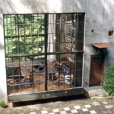 an open window shows the inside of a home office