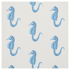 a blue sea horse pattern on white fabric