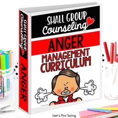 an anger management book with pencils and markers