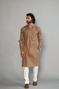 This is a bespoke product, specially crafted for you.  Crafted in Chinese Collar and Full Sleeves Available with a Cotton Pajama in White, It has a hand-block printed design all over it which makes it best outfit for your Wedding Function, Diwali, Eid, Durga Pooja and Cocktail Parties. Do note: Footwear shown in the image are also made to order and can be added separately, but it takes 15 days processing time.  (Slight variation in actual color vs. image is possible) Unstitched Suit With Block Print For Wedding, Festive Block Print Lawn Suit For Wedding, Wedding Lawn Suit With Block Print, Cotton Kurta With Block Print For Wedding, Cotton Block Print Kurta For Wedding, Wedding Unstitched Cotton Suit With Block Print, Festive Wedding Lawn Suit With Block Print, Brown Fitted Long Sleeve Kurta, Festive Brown Sets For Diwali