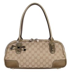 Authentic, pre-loved Gucci brown and gold monogram Princy Boston shoulder bag. The Princy shoulder bag features a canvas body with gold leather trim, rolled leather straps, a top zip closure, and an interior zip pocket. Strap drop: 8" Authenticity code reads: 161720486628 Light Brown Shoulder Bag With Gold-tone Hardware, Brown Shoulder Bag With Gold-tone Hardware, Brown Monogram Print Shoulder Bag, Luxury Brown Shoulder Bag With Gold-tone Hardware, Leather Formal Shoes, Luxury Brown Monogram Print Bag, Bag Packaging, Gold Monogram, Gold Leather