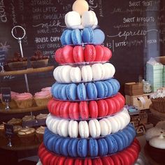 a stack of red, white and blue macaroons sitting on top of each other