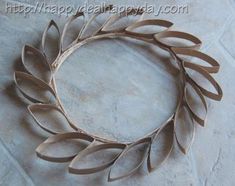 a close up of a metal wreath on a tile floor