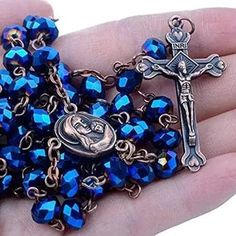 Blue Crystal Beads Rosary Catholic Deep Blue Crystal Beads Rosary Vintage design metal Cross Crucifix long beaded necklace with Jerusalem Holy soil medallion In The Middle. Cross (H X W) : 4 cm x 2.5 cm / 1.6" x 1" Catholic Rosary necklace fit for an adult with a perfect chain length of 18", Customized Gift Velvet Bag. The Rosary necklace chain and the crucifix are made of zinc and coated with silver, preventing corrosion and never turning black. Communion rosary connected to devout 59 beads per Blue Rosary, Blue Crystal Beads, Rosary Jewelry, Rosary Beads Catholic, Catholic Necklace, Gold Rosary, Faith Jewelry, Mother Of Pearl Jewelry, Catholic Rosary