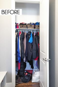 an open closet with clothes hanging on hooks