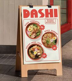 a sign advertising different types of food on the side of the road in front of a building