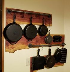 pots and pans are hanging on the wall