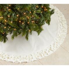 a christmas tree skirt with lights on it