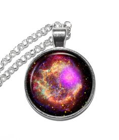 "Handmade art pendant necklace featuring a picture of Cassiopeia constellation. Cassiopeia is a constellation found in the northern sky. It is famous for its distinctive \"W\" shape. This asterism is formed by five bright stars; Epsilon, Ruchbah (Delta), Gamma, Schedar (Alpha Cassiopeiae), and Caph (Beta Cassiopeiae). The Cassiopeia constellation gets its name from the vain Queen Cassiopeia found in Greek Mythology. This beautiful art glass pendant has been carefully handcrafted by me in my home Space-themed Pendant Necklace As Gift, Galaxy Space Universe, Astronomy Necklace, Cassiopeia Constellation, Nebula Necklace, Buddhist Necklace, Space Necklace, Galaxy Necklace, Space Universe