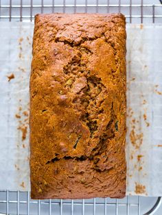 a loaf of bread sitting on top of a cooling rack