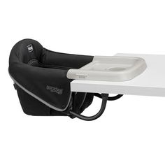 a baby seat attached to the side of a white table with a blue cover on it