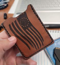 "Minimalist leather wallet with distressed American Flag engraving on one side and \"We The People\" on the other side Full grain leather, hand stitched and hand dyed.  This elegant yet simple wallet is great for showing your personality or as a gift! This wallet is handmade from leather with love from my home to yours. Hand stitched, crafted and a wonderful addition for a man or woman. Just add your credit card, ID and some cash for a night on the town or a romantic dinner. Visit our group on Facebook to see more creations made by the Tactical Hippie! https://www.facebook.com/groups/479101717371875 Thank you for supporting our small business!" Handmade Rustic Wallet For Everyday Use, Rustic Handmade Wallets For Everyday Use, Hand Tooled Leather Trifold Wallet For Everyday Use, Leather Trifold Wallet Hand Tooled For Everyday Use, Leather Hand Tooled Trifold Wallet For Everyday Use, Distressed American Flag, Simple Wallet, Minimalist Leather Wallet, Card Id