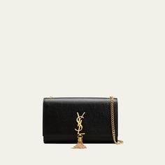 Saint Laurent crossbody bag in calf leather. Chain shoulder strap, 19" drop. Can be worn over the shoulder or across the body. Flap top with YSL logo medallion tassel. Golden hardware Interior wall pocket and six card slots. Approx. 6"H x 9.5"W x 2.25"D. Item weight, 1 lb. "Kate" is made in Italy. Evening Bags With Logo Charm, Elegant Evening Wallet On Chain With Logo Plaque, Elegant Wallet On Chain With Logo Plaque, Luxury Formal Bags With Logo Charm, Chic Evening Bags With Logo Charm, Elegant Evening Bag With Logo Charm, Saint Laurent Crossbody Bag, Ysl Wallet On Chain, Ysl Wallet