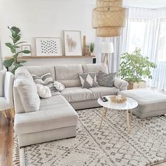 a living room filled with furniture and a rug