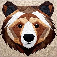 a close up of a bear's face on a quilted wallhangel