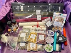 the contents of a crafting kit laid out on a purple cloth