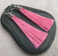 "Chic pink tassel earrings! They would add a pop of color to any outfit for any occasion. Dress them up or down. They are timeless and versatile. They are lightweight, fun and unique! The tassels measure 2 1/8\" long by 1/4\" wide. They hang from simple silver ear wire hooks. Overall drop length is about 2 1/4\". Metal is allergy free plated silver. These are my latest creation! I have them available in many colors! Find them all under the category tassel earrings in my shop. Thanks for stopping Pink Tassel Earrings As Gift, Pink Dangle Tassel Earrings For Gifts, Pink Tassel Earrings For Gift, Acorn Jewelry, Pink Statement Earrings, Green Tassel Earrings, Pink Tassel Earrings, Gifts Pink, Lover Jewelry