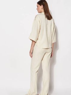 Crafting high-quality loungewear that offers comfort and style in equal measure. It's made from 100% organic cotton for a breathable and comfortable fit.- Featuring an oversized crop shirt- Straight-leg lounge pants- Model is 176 cm tall and wears a size SCARE INSTRUCTIONS- Machine wash cold or by hand at maximum temperature of 30°- Dry in shade only- If you wish to iron, use steam iron only without iron contact Natural Lounge, Stylish Loungewear, Short Shirt, Lounge Set, Short Shirts, Lounge Sets, Women Supporting Women, New Wardrobe, Crop Shirt