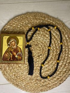 Discover the essence of spiritual devotion with our meticulously crafted Pocket Prayer Rope, available in a variation of 100 knots, each adorned with a delicately braided cross. Our Orthodox Prayer Rope, also known as Komboskini or Orthodox Rosary, is meticulously crafted to the highest standards. It features a precise distance of 10 prayer knots between wood dividers, ensuring a seamless experience of prayerful meditation. Experience premium quality in every detail - from the tight, expert weav Spiritual Black Beaded Necklaces, Bohemian Beaded Rosary For Meditation, Spiritual Beaded Rosary For Blessing, Spiritual Hand Knotted Beaded Necklaces For Festivals, Spiritual Hand Knotted Beaded Necklace For Festivals, Spiritual Beaded Necklaces For Beach, Traditional Beaded Rosary For Meditation, Traditional Black Beads For Meditation, Spiritual Yellow Wooden Beads