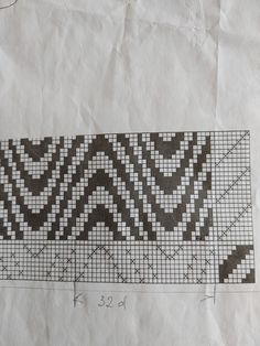 a piece of paper that has some type of pattern on it, and is drawn in black and white