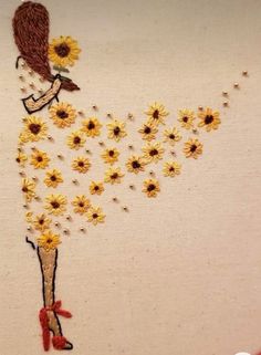 a woman with sunflowers on her dress