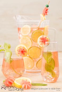 several glasses filled with lemonade and watermelon