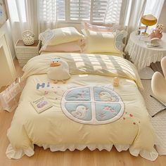 a bed room with a neatly made bed next to a chair and window sill