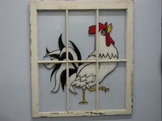 an old window with a rooster painted on the side and a chicken in the middle