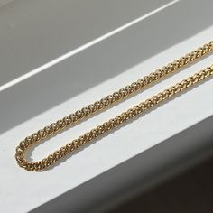 Our Curb Chain necklace adds style and edge to your outfit. This chain can be worn on its own as a statement or be layered with other chains from our shop. Great for people with sensitive skin and an affordable alternative to solid 18k gold because this necklace is waterproof and tarnish resistant. Hypoallergenic Stainless Steel with thick layer of 18k gold PVD coating. BUY 2, GET 1 FREE. Coupon applied at checkout. - 18k gold plated- Chain width: 6mm- Chain length: 18 inch + 2 inch extension- W Gold Cuban Link Necklace With Cable Chain As Gift, Gold Cuban Link Necklace With Cable Chain, Layering Curb Chain Link Necklace, Curb Chain Link Necklace For Layering, Gold Cuban Link Double Chain Necklace, Gold Plated Double Chain Link Necklace, Minimalist Cuban Link Chunky Chain Necklace, Gold Cuban Link Necklace With Chunky Chain, Minimalist Chunky Cuban Link Chain Necklace