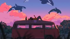 two people are sitting on the roof of an old vw van in front of orca whales