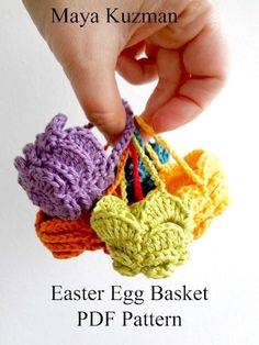 a hand holding an easter egg basket with crochet