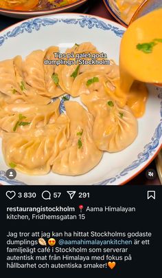 some dumplings are being served on a plate