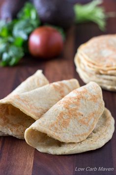 some tortillas are stacked on top of each other with the words, almost zero carb wraps low carb keto