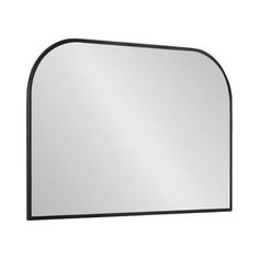 a mirror that is on the wall with a black frame and an arched design around it