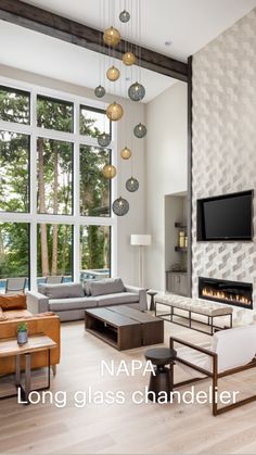 a living room filled with furniture and a flat screen tv mounted to the wall next to a fire place