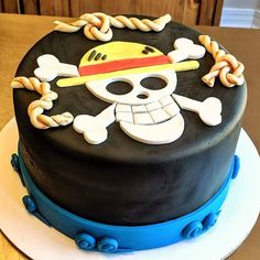 a birthday cake decorated with a pirate skull and crossbones