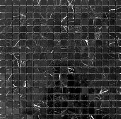 a black and white photo of some kind of glass mosaic tile pattern that looks like it has been cut in half