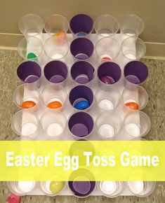 an easter egg toss game on the floor with plastic cups in front of it and text overlay that reads, easter egg toss game