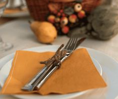 a white plate topped with a fork and knife