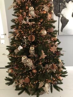 a decorated christmas tree with lights and ornaments