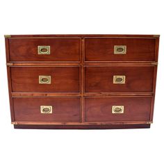 an old wooden dresser with brass handles on it's sides and four drawers in the middle