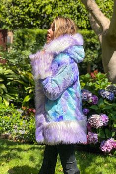 WOMEN'S PLAYA PETITE COAT  FEATURES High quality faux fur. Lined with ultra cozy cuddle seal fabric. 2 Inside zipper pockets on the front sides of the coat. 2 Outside pockets to keep your hands warm. 6" Invisible zipper ID "secret" pocket on the inside left chest lining. 4  Hook & eye closures. Inside back pack str Hooded Faux Fur Coat With Pockets, Winter Blue Faux Fur Coat, Winter Purple Faux Fur Coat, Blue Faux Fur Coat For Winter, Purple Faux Fur Coat For Winter, Blue Faux Fur Winter Coat, Winter Purple Faux Fur Outerwear, Purple Faux Fur Winter Outerwear, Purple Faux Fur Outerwear For Winter