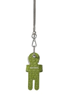 a keychain with a green teddy bear on it's front and back ends