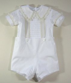 This beautiful, handmade boys' ensemble is perfect for special occasions. Pima Broadcloth shirt has tucked front with English and French lace insertions, entredeux and pinstitching. The Peter Pan collar and the cuffs of the shirt are edged with pinstitching and a French lace edge that is sewn on flat. Shirt has pearl button closure on back for a finished look. Pearl buttons on bottom of shirt to accommodate button-on shorts. Please contact me with any sizing questions. Check out my other listing Elegant Fitted Sets With Pintucks, Fitted Lace Trim Set For Baptism, Heirloom Flower Girl Dress, Boy Sewing, Angel Gowns, Heirloom Dresses, Baptism Outfit, Christening Outfit, Heirloom Sewing