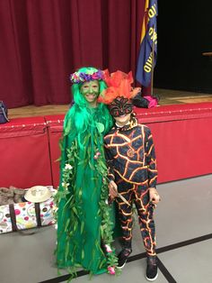 two people in costumes standing next to each other