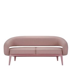 a pink couch sitting on top of a white floor